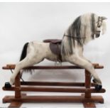 Victorian style Rocking Horse, carved wood and painted dapple grey, hardwood stand, height 135cm,