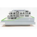 Scale architects model of a house, 1:75 scale, built on a sloped base with balconies, windows,