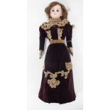 Victorian bisque headed doll; stamped DEP 4 on the back of the head, with leather body and limbs,