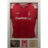 Nottingham Forest Football club signed football shirt, framed 66cm by 95cm,