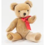 Merrythought plush teddy bear, with jointed limbs and red ribbon, 51cm.