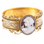 A yellow metal half hinged cameo bangle in the Victorian style,