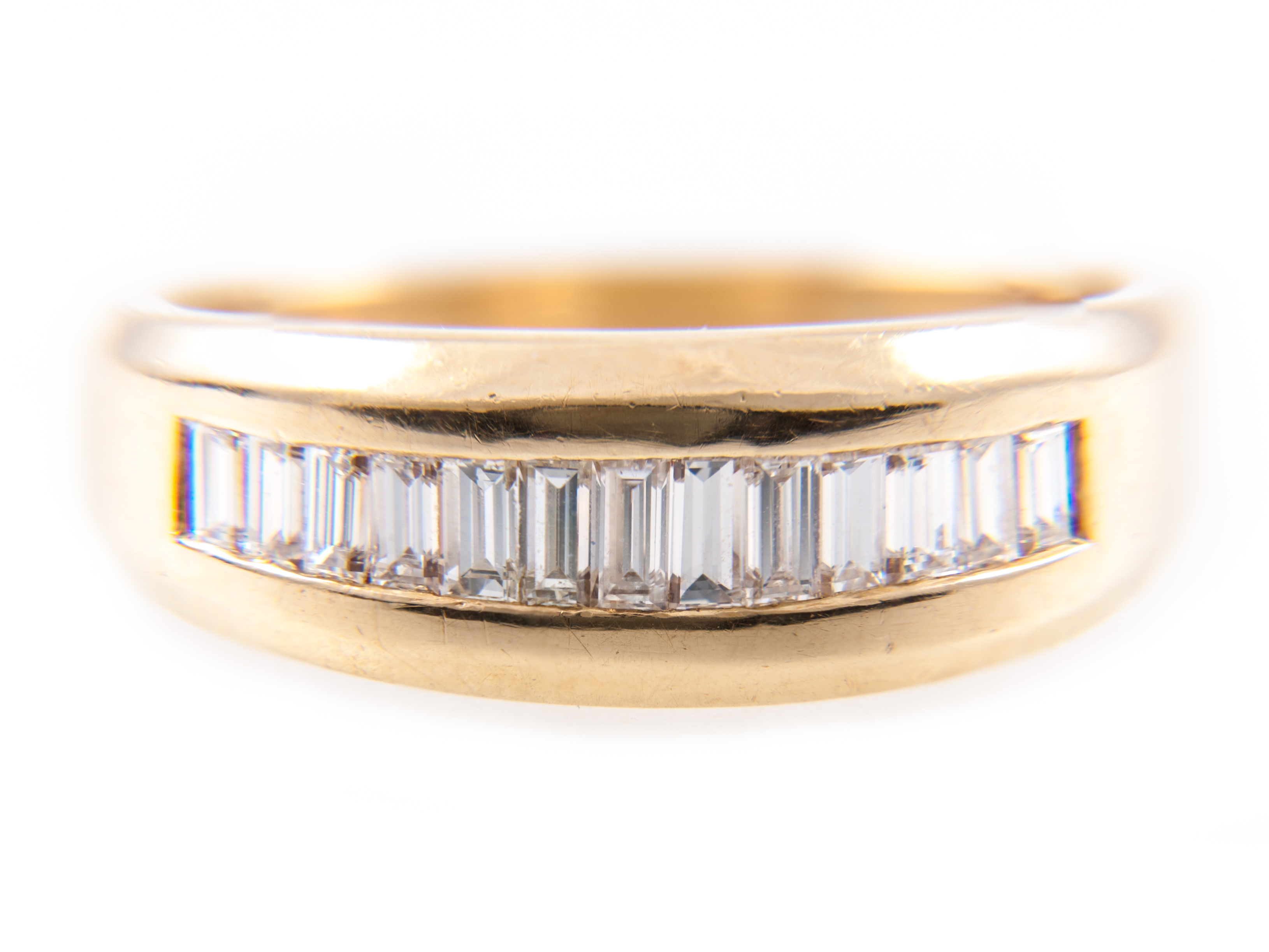 A diamond half eternity ring, thirteen baguette cut diamonds, graduating in size,