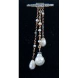 A diamond and pearl brooch,