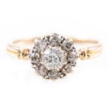 A circular diamond cluster ring,