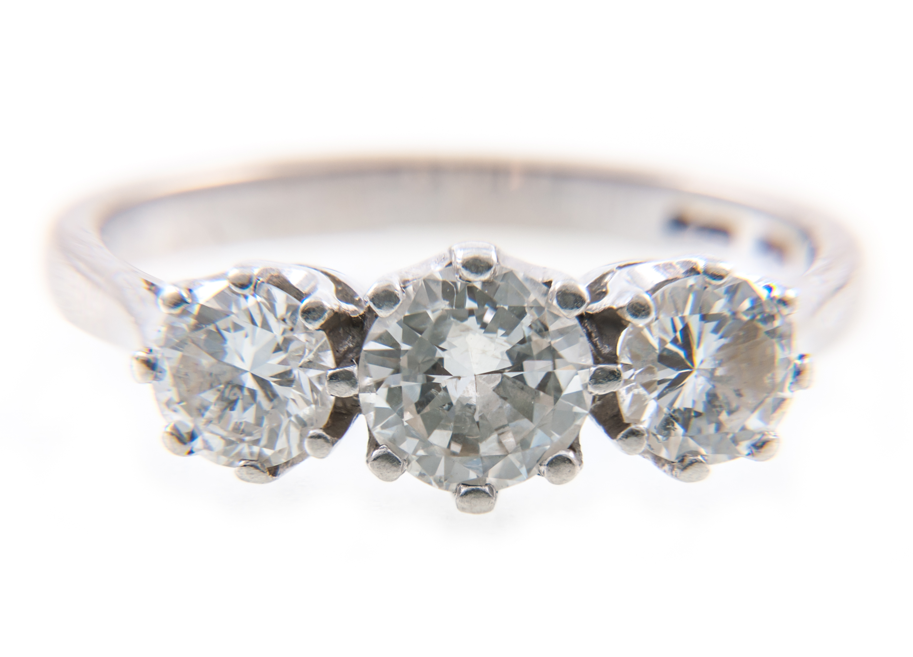A diamond three stone ring, the brilliant cut stones, graduating in size,