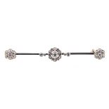 A diamond bar brooch,