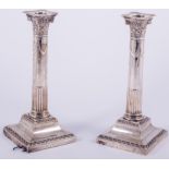 A pair of silver table candlesticks, by Hawkswood Eyre & Co.