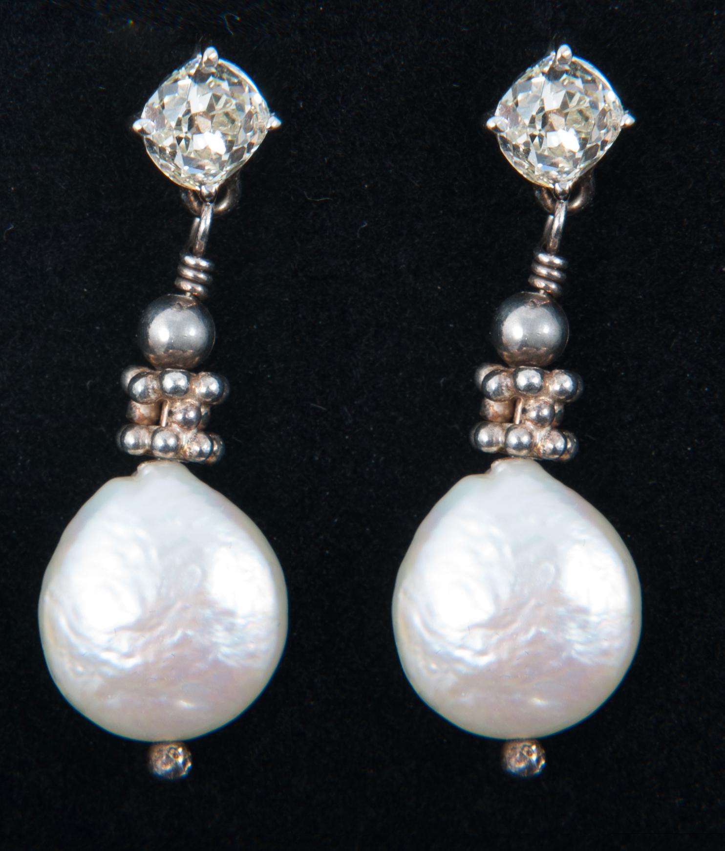 A pair of diamond and freshwater pearl earrings,