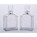 A pair of heavy cut glass spirit decanters, with silver collars, by Barker Ellis, Birmingham 1986,