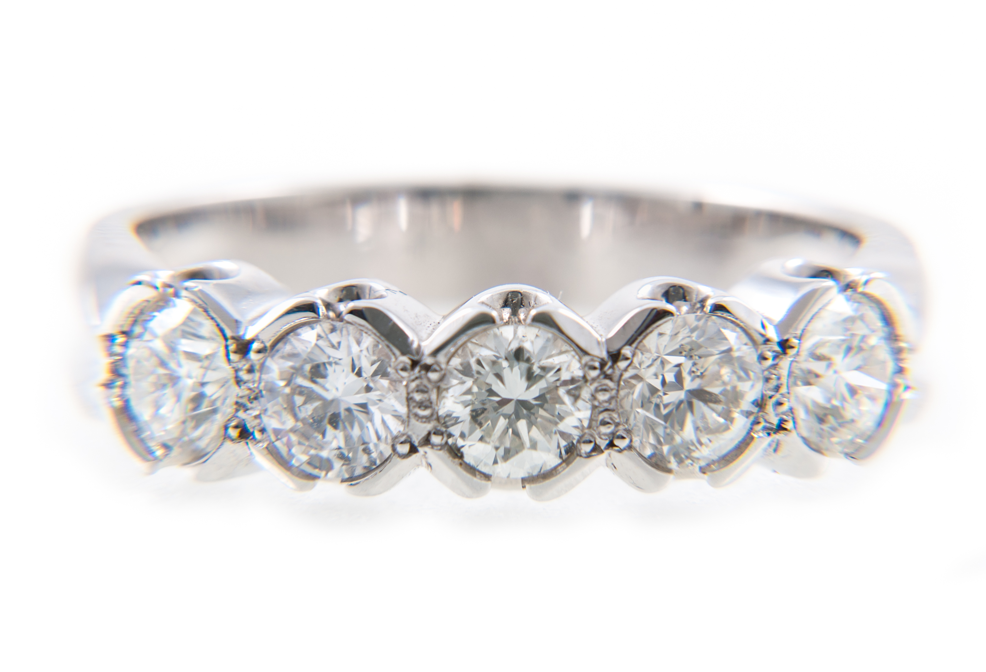 A diamond five stone half hoop ring,