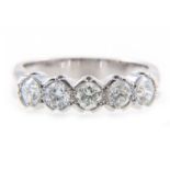 A diamond five stone half hoop ring,