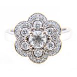 A diamond circular floral cluster ring,