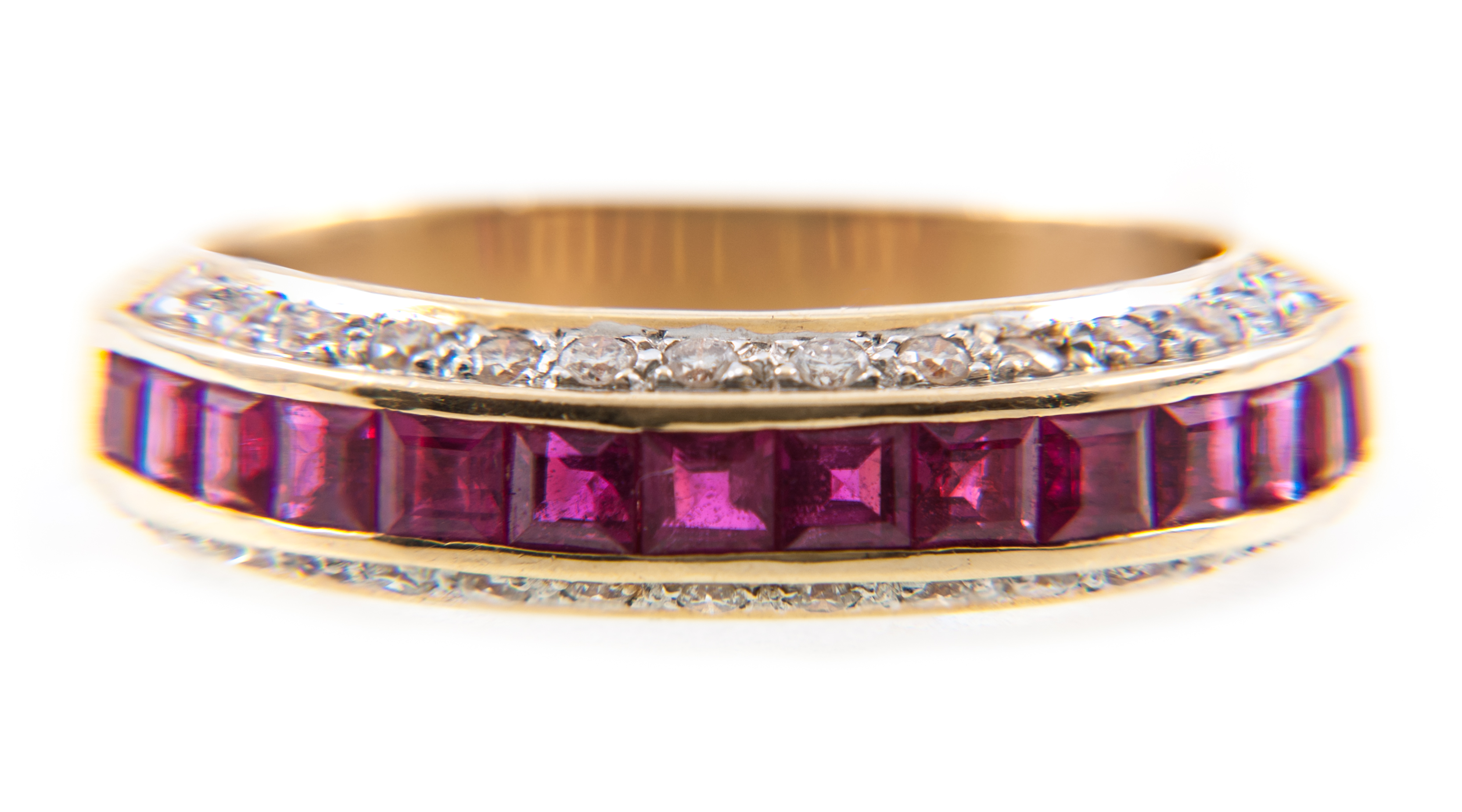 A ruby and diamond half eternity ring,