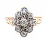 A diamond oval cluster ring,