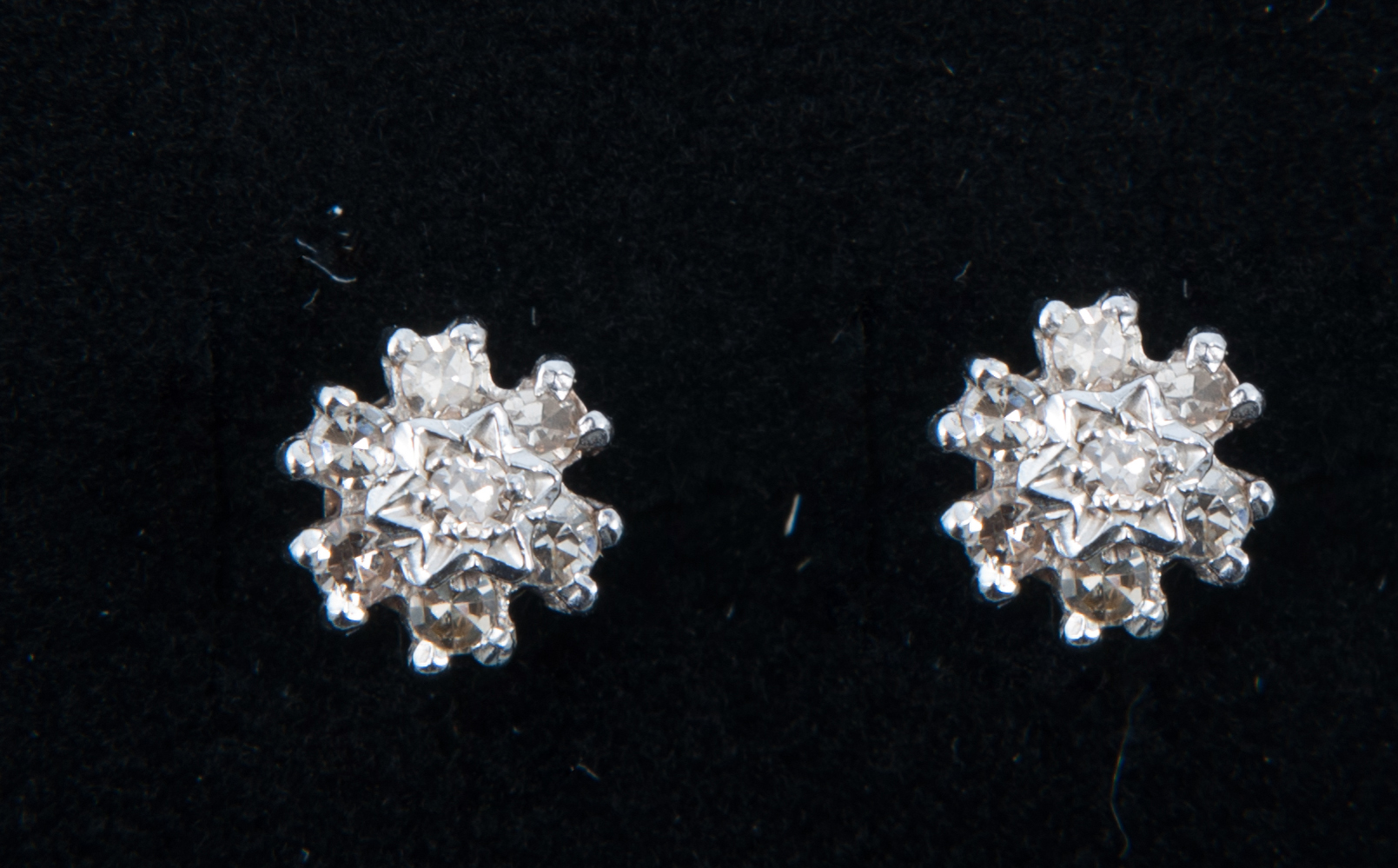 A pair of diamond circular cluster earrings,