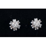 A pair of diamond circular cluster earrings,