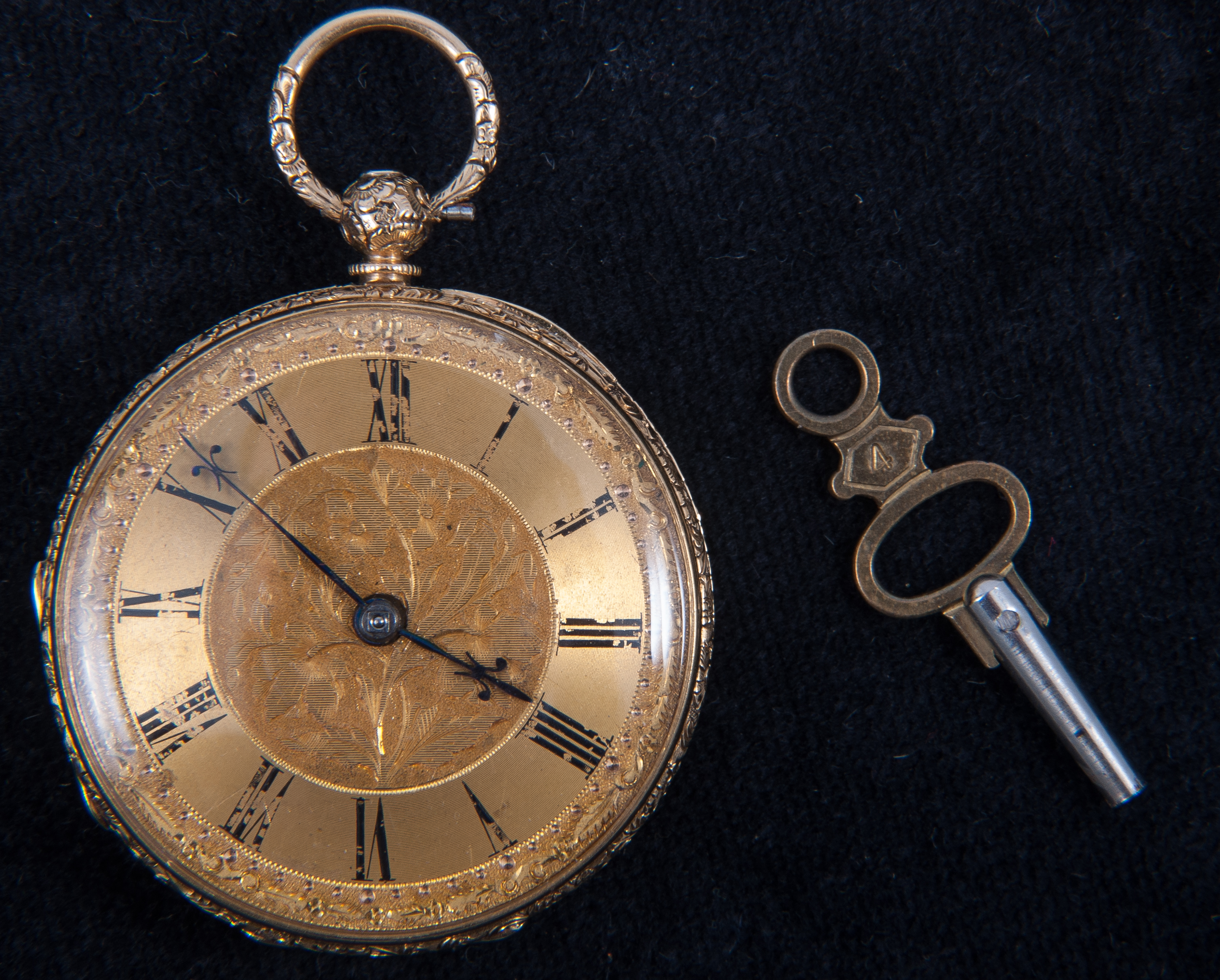 A small 18 carat yellow gold open face pocket watch, gold coloured Roman numeral dial,
