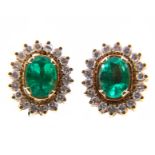 A pair of emerald and diamond oval cluster earrings,