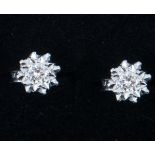 A pair of diamond single stone earrings, one brilliant cut diamond illusion set to each,