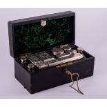 A Victorian black cloth travelling case, by J.T.