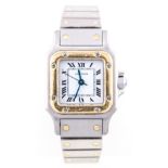 Cartier - A lady's stainless steel and gold Santos wrist watch,