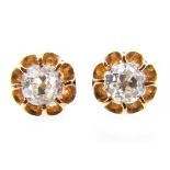 A pair of diamond single stone earrings, one old brilliant cut diamond eight claw set to each,