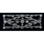 A diamond white metal bar brooch,