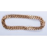 A yellow metal bracelet, 6.7mm wide flat curb link chain,18.