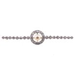 A diamond and pearl white metal bar brooch,