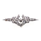 A diamond set white metal bar brooch,