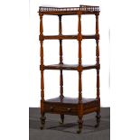 An early Victorian rosewood four-tier whatnot,