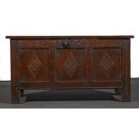 A joined oak coffer, basically 18th century, rectangular hinged top with three plain panels,