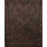 An Anatolian rug, with three joined lozenge medallions, on a patterned field with botah motifs,