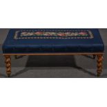 A Victorian rosewood stool, gros point upholstery, rectangular seat on tapering barley twist legs,