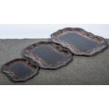 A set of three graduating Victorian papier-mâché shaped oval trays,