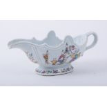 A Chinese export porcelain sauce boat, Quinlong, moulded silver shape,