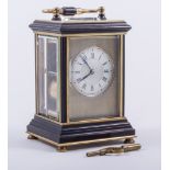 A French brass and ebonised carriage clock, silvered dial, signed F.G.
