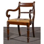 A set of five Regency mahogany dining chairs, broad crestings, spiral twist horizontal rails,