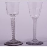 A wine glass, probably late 18th century, lower fluting to the rounded funnel bowl,