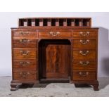 A George III mahogany desk, super structure with nine pigeon holes, tooled leather surface,