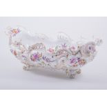 A German porcelain table centrepiece, 20th century, boat-shape with rococo outlines,