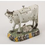 An earthenware polka dot cow creamer, probably Staffordshire, circa 1800, model with a calf,