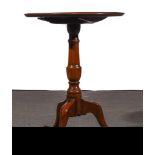 A George III mahogany pedestal table, circular tilt top, with a raised moulded edge,