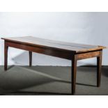 A joined oak table, rectangular boarded top with cleated ends, one frieze drawer,