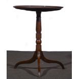 A George III mahogany pedestal table, circular top with a moulded edge, ringed, column, tripod legs,