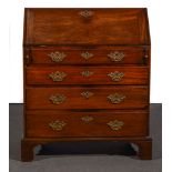 A George III mahogany bureau, fall front enclosing a fitted interior with a cupboard,