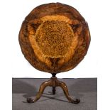 A late Victorian walnut and inlaid occasional table, circular tilt top with segmentary veneers,