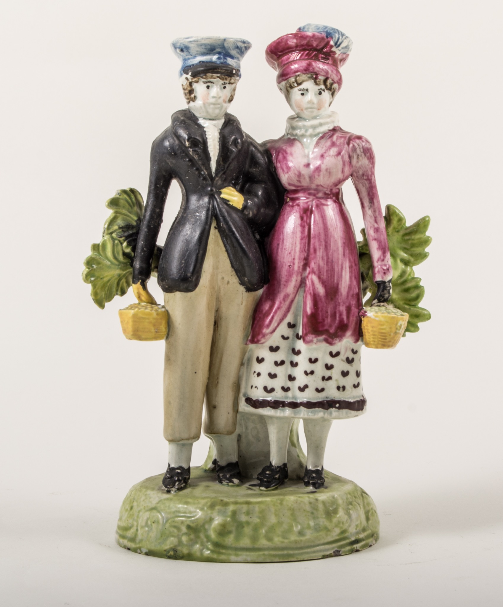 A Pearl glazed earthenware bocage group of Dandies, Staffordshire, circa 1820,