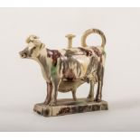 A Staffordshire creamy earthenware cow and calf creamer, Whieldon type, late 18th century,